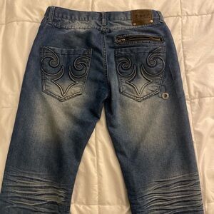 Size 32 Departed blue jeans with a slim straight fit, featuring a unique design